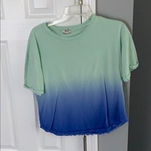Light and darker blue tee shirt.